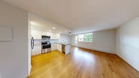Located at 156-158 Fitch Street in Welland, Ontario, this well-appointed one-bedroom, one-bathroom unit offers a thoughtfully designed layout with a clean, modern aesthetic throughout. Warm hardwood-style flooring flows seamlessly across the entire space, lending a cohesive and inviting feel to every room.

The open-concept kitchen is a standout feature, boasting white shaker-style cabinetry reaching to the ceiling, a light blue subway tile backsplash, stainless steel appliances including a refrigerator, range, and over-the-range microwave, and a peninsula with a neutral-toned countertop and undermount sink — ideal for casual dining or food preparation.

The living area is generously proportioned, benefiting from a large floor-to-ceiling window that floods the room with natural light and offers views of the surrounding neighbourhood's mature trees and landscaped grounds. A ceiling fan adds both function and comfort to the space.

The bedroom is a comfortable, well-lit room featuring a double sliding-door closet and a window overlooking greenery, providing a calm and private retreat. The bathroom is finished in crisp white, with full-height tile surrounding a soaker tub and shower combination.

A private balcony extends the living space outdoors, offering pleasant views of the landscaped courtyard and tree-lined streets below.
