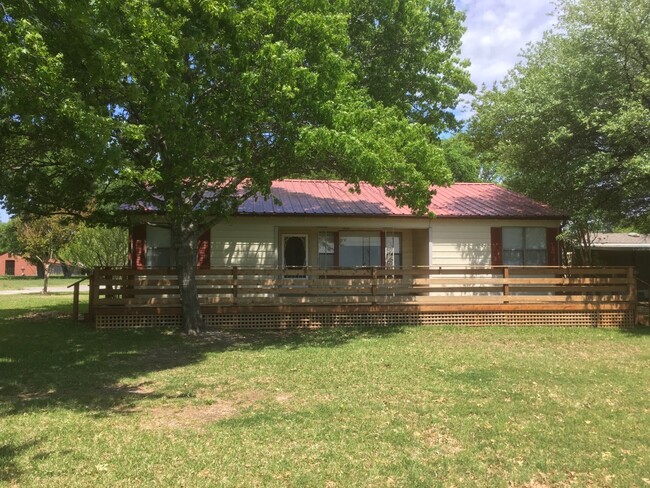 Front of house and deck - 5703 FM813