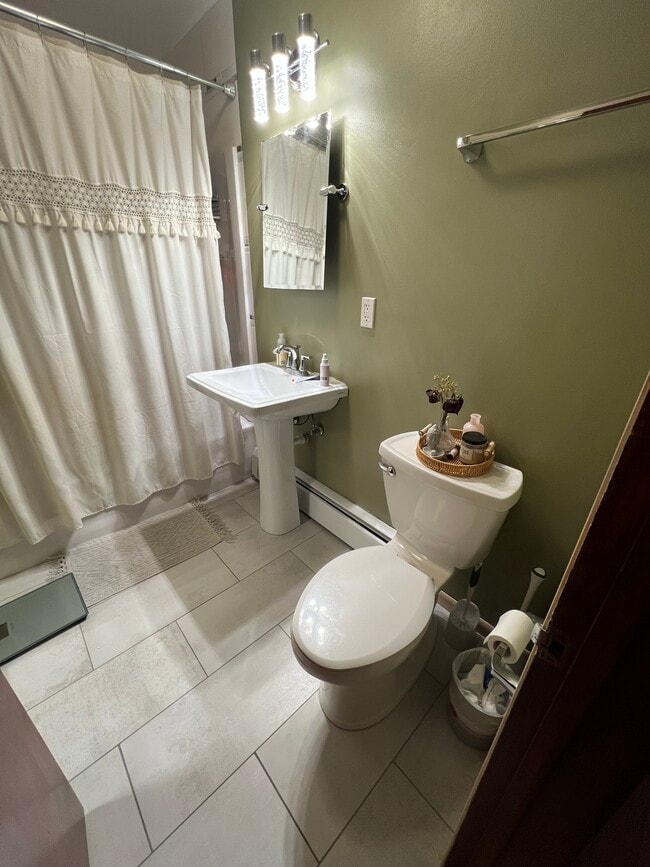 New paint and tile, actual bathroom - 2113 N Sherman Ave