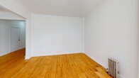 This 830 square foot apartment in Chicago's Chatham neighborhood offers a well-designed living space with three bedrooms and one bathroom. The single-floor layout maximizes functionality, with the primary bedroom boasting 160 square feet of space. The interior showcases beautiful hardwood floors throughout, creating a warm and inviting atmosphere.

The kitchen has been updated with modern appliances, including a stainless steel refrigerator and gas stove, making meal preparation efficient and enjoyable. The living areas are bathed in natural light, thanks to multiple windows, some featuring charming bay configurations that add architectural interest.

Each bedroom offers ample space and includes practical amenities such as radiators for comfort during Chicago's cooler months. The bathroom has been renovated with contemporary tiles and fixtures, including a combination bathtub and shower.

The apartment's layout includes two separate living room areas, providing versatile spaces for relaxation or entertainment. A hallway connects the various rooms, ensuring a smooth flow throughout the home. With its blend of classic features and modern updates, this apartment offers a comfortable and stylish living environment in a convenient Chicago location.