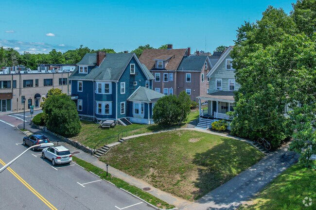 Large homes with green space are present over Wellesley.