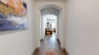 Located at 4121 San Antonio St in Odessa, Texas, this 2-bedroom, 2-bathroom home offers a cohesive and well-designed single-story layout. A welcoming hallway with a distinctive arched entryway and warm wood-look flooring sets the tone for the interior, leading into an open and inviting living room. The living area features crown molding, a ceiling fan, and natural light from multiple windows, complemented by neutral walls that create a bright and airy atmosphere.

The galley-style kitchen is equipped with dark espresso cabinetry, granite countertops, stainless steel appliances, and pendant lighting, offering both style and function. Adjacent to the kitchen, the dining area benefits from a bank of windows that flood the space with natural light. Both bedrooms are carpeted and generously sized, with the primary bedroom providing ample room and access to a well-organized walk-in closet featuring built-in shelving and dual hanging rods. The primary bathroom includes a glass-enclosed shower, dark vanity cabinetry with granite countertops, and wood-look tile flooring. A dedicated laundry room with side-by-side washer and dryer adds everyday convenience. Three hallways connect the spaces seamlessly throughout the home.