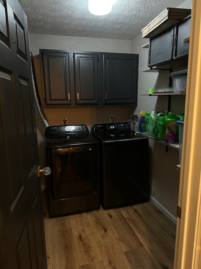 Laundry with lots of built in shelves - 6615 Hedington Sq
