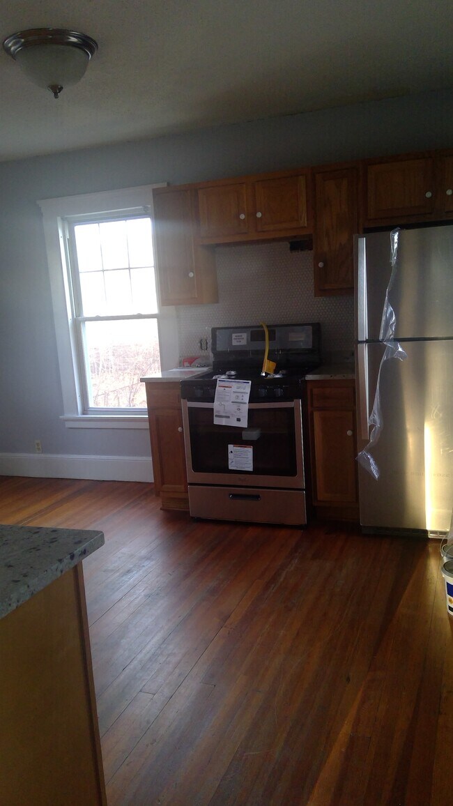 Kitchen angle from hallway (range hood above the oven to be installed) - 435 Main St