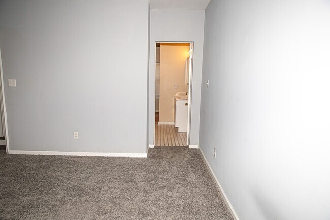 FRONT BEDROOM VIEW WITH BATHROOM DOR - 409 N Monroe St