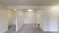 Located at 5054 Beckley Rd in Kalamazoo, Michigan, this single-floor unit offers a practical and comfortable layout throughout. The living area is generously sized, featuring soft grey carpeting, neutral cream-toned walls, and a textured ceiling. A sliding glass door opens directly onto a private balcony, allowing natural light to fill the space and providing pleasant views of the surrounding outdoor scenery.

The dining area sits adjacent to the living room and flows seamlessly into the kitchen, which is equipped with wood-accented cabinetry, white countertops, a gas range with overhead ventilation, a dishwasher, and a full-size refrigerator. Durable wood-look flooring runs through the kitchen, adding a warm contrast to the lighter cabinetry.

The bedroom offers a comfortable retreat with plush carpeting, a window that brings in natural light, and a full-width closet featuring louvered bi-fold doors, a hanging rod, and built-in shelving for ample storage.

The bathroom includes a tiled shower-tub combination with warm-toned tile surround, a toilet, and a vanity with a sink, all set on wood-look flooring that complements the rest of the unit. Throughout the space, the clean, neutral palette creates a bright and move-in ready environment.