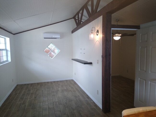 Living area with AC unit. - 9328 N Ashley St