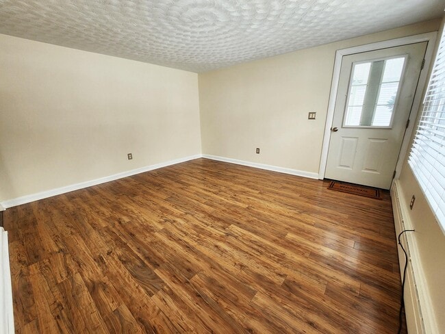 Large living room with new flooring - 216 5th St