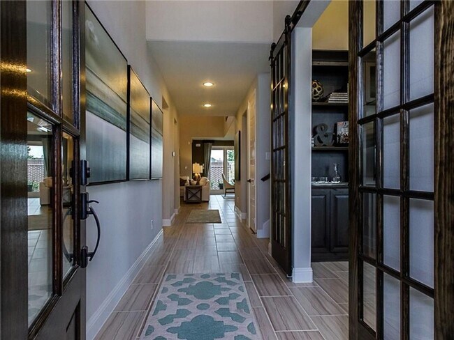 Building Photo - A large island in the gourmet kitchen anch...