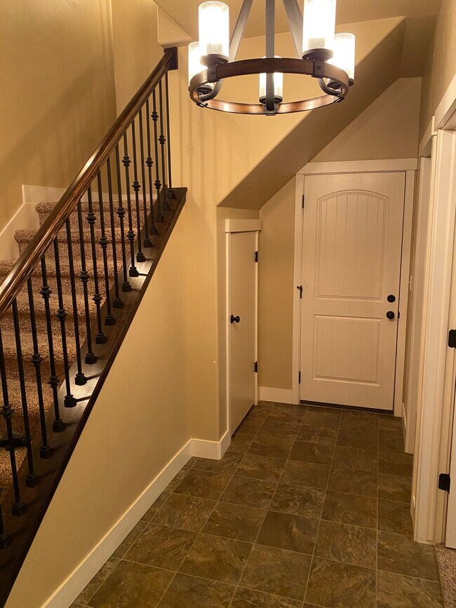 First floor- garage entry & storage under stairs - 136 W Parramatta Ln
