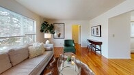 Located at 174 Kinderkamack Rd in Westwood, NJ, this single-floor residence offers a thoughtfully laid-out living environment with consistent finishes throughout. Warm hardwood flooring runs through the main living and sleeping areas, lending cohesion and a sense of continuity across the space.

The living room is bright and welcoming, benefiting from a large multi-pane window that draws in natural light and provides views of the surrounding neighborhood. The room offers ample space for both seating and a work area, making it versatile for everyday use.

Adjacent to the living room, the dining area is a defined, intimate space with hardwood floors, a window for natural light, and clean white walls that keep the atmosphere open and neutral.

The kitchen is practical and well-equipped, featuring warm honey-toned cabinetry, stone-look countertops, stainless steel appliances including a gas range, dishwasher, and refrigerator, along with tile flooring and a window above the sink.

The bedroom is generously proportioned, featuring hardwood floors, multiple windows that admit natural light, and a calm, neutral color palette that promotes a restful environment.

The bathroom is finished with classic white subway tile surrounding a full soaking tub and shower combination, complemented by a window for ventilation and light.
