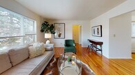 Located at 174 Kinderkamack Rd in Westwood, NJ, this single-floor residence offers a thoughtfully laid-out living environment with consistent finishes throughout. Warm hardwood flooring runs through the main living and sleeping areas, lending cohesion and a sense of continuity across the space.

The living room is bright and welcoming, benefiting from a large multi-pane window that draws in natural light and provides views of the surrounding neighborhood. The room offers ample space for both seating and a work area, making it versatile for everyday use.

Adjacent to the living room, the dining area is a defined, intimate space with hardwood floors, a window for natural light, and clean white walls that keep the atmosphere open and neutral.

The kitchen is practical and well-equipped, featuring warm honey-toned cabinetry, stone-look countertops, stainless steel appliances including a gas range, dishwasher, and refrigerator, along with tile flooring and a window above the sink.

The bedroom is generously proportioned, featuring hardwood floors, multiple windows that admit natural light, and a calm, neutral color palette that promotes a restful environment.

The bathroom is finished with classic white subway tile surrounding a full soaking tub and shower combination, complemented by a window for ventilation and light.