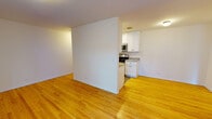 Located at 424 W Oakdale Ave in Chicago's desirable Lakeview neighborhood, this single-floor unit offers a clean, well-maintained layout with a warm and inviting atmosphere throughout. Warm-toned hardwood floors extend continuously across the living areas and bedroom, lending cohesion and a classic charm to the space.

The open living and dining area is defined by crisp white walls and a partial dividing wall that subtly separates it from the kitchen, maintaining an airy, connected feel. Natural light filters in through a window fitted with blinds, and a wall-mounted HVAC unit ensures year-round comfort alongside baseboard heating.

The kitchen is efficiently designed with white shaker-style cabinetry, granite countertops, and stainless steel appliances including a gas range, microwave, and refrigerator. Recessed lighting illuminates the workspace, and the light wood-style flooring ties seamlessly into the overall aesthetic.

The bedroom is a generously proportioned, light-filled room with hardwood flooring, a large window, and access to a closet, offering a peaceful retreat.

The bathroom is neatly appointed with white subway tile surrounding a full tub and shower, a marble-topped vanity with dark cabinetry, and classic mosaic tile flooring — combining functionality with a refined finish.