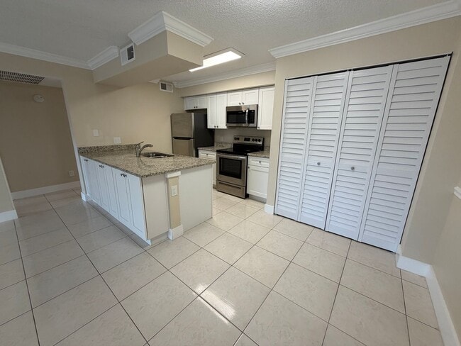 Building Photo - ANNUAL RENTAL - 2 BED / 2 BATH CONDO AT MYSTIC GARDENS