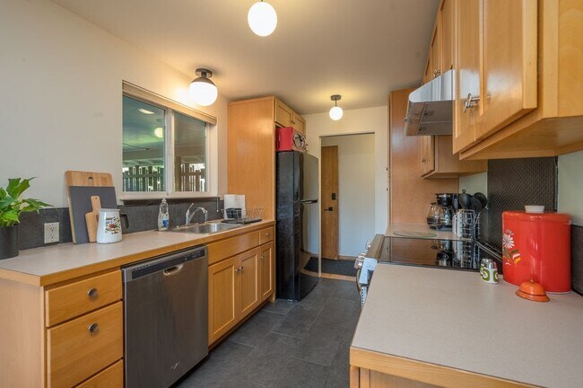 Galley style kitchen with newer appliances - 11417 99th Ave SW