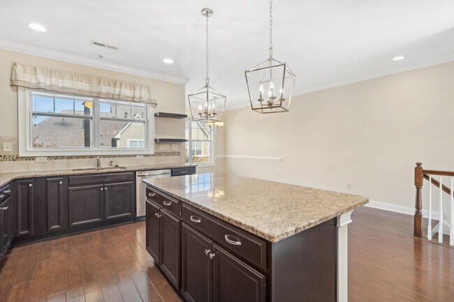 Building Photo - Introducing a stunning three-story townhom...