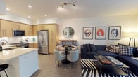 Located at 3425 W Olive Ave in Burbank, California, this well-appointed single-floor residence offers a thoughtfully designed open-concept layout that seamlessly connects the living, dining, and kitchen areas. The kitchen is outfitted with warm wood cabinetry, white quartz countertops, a classic tile backsplash, and a full suite of stainless steel appliances including a gas range, built-in microwave, and French door refrigerator — ideal for everyday cooking and entertaining. The living area features hardwood-style flooring, large windows that invite abundant natural light, and direct access to an outdoor balcony with views of the surrounding community. The bedroom is a serene retreat highlighted by a bold accent wall, recessed lighting, a ceiling fan, and corner windows that further enhance the airy feel. The bathroom is finished with herringbone-patterned tile flooring, a sleek vanity with an undermount sink, and a tub-shower combination enclosed in glass. A hallway utility closet houses a stacked in-unit washer and dryer for added convenience. Throughout the space, clean white walls and contemporary fixtures create a cohesive, modern aesthetic well-suited to life in the heart of Burbank's entertainment district.