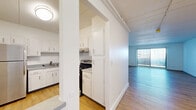 Located at 297 Turnpike Rd in Westborough, MA, this one-bedroom, one-bathroom residence offers a practical and well-organized layout across a single floor. Light-toned hardwood-style flooring runs throughout the main living areas, lending a clean, cohesive look to the space.

The living room is generously sized, bathed in natural light through a large sliding glass door fitted with vertical blinds, creating an open and airy atmosphere. The kitchen is efficiently designed with crisp white cabinetry extending from floor to ceiling, a stainless steel refrigerator, a gas range, a built-in dishwasher, and a single-basin sink with a modern faucet — all set against light countertops that complement the bright, clean aesthetic.

The bedroom is a comfortable retreat featuring plush wall-to-wall carpeting, a large window with vertical blinds for natural light and privacy, and a built-in closet with open shelving for organized storage.

The bathroom maintains the home's clean, neutral palette with a white vanity, a wide mirror with overhead lighting, brushed nickel fixtures, and a full tub-shower combination — all accented by warm hardwood-style flooring. Throughout the residence, white walls and neutral finishes create a bright, move-in-ready environment.