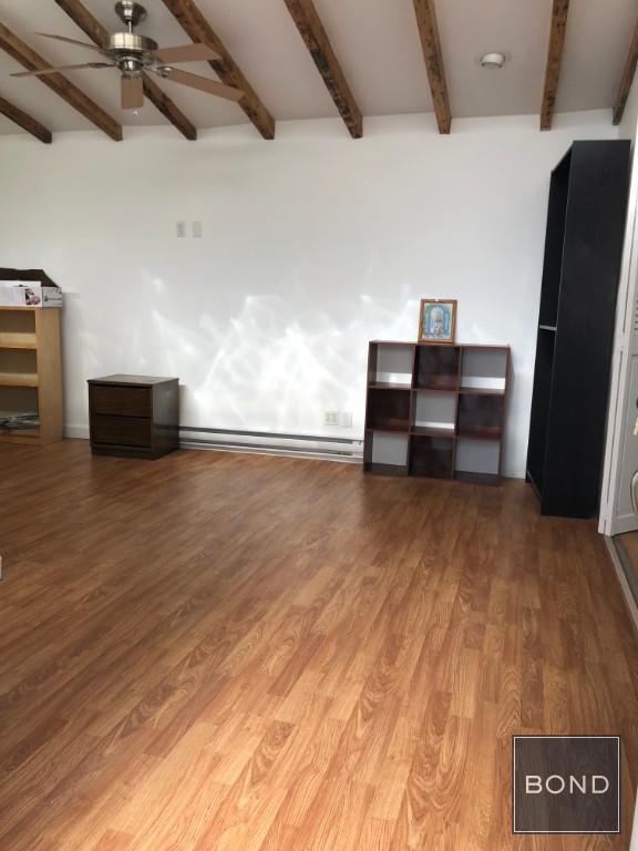 Building Photo - Massive Studio with Garden Awaits You in P...