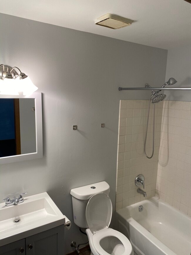 Updated bathroom with a detachable shower head. - 7048 Beulah Ave