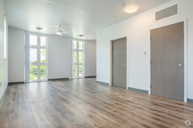 3BR, 2BA - 1,250SF - Living Room - Amphora Apartments