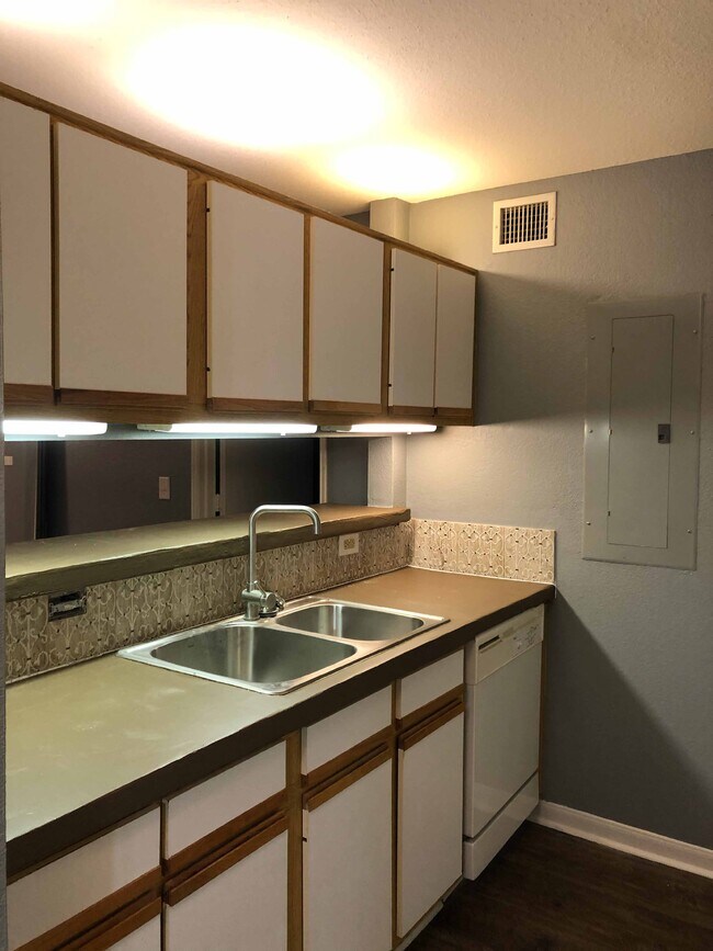 Kitchen Area-Cabinets recently painted no longer brown - 521 Southwest Pkwy