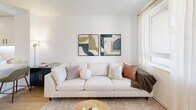 Located at 414 Front St in Santa Cruz, CA, this thoughtfully designed one-bedroom, one-bathroom residence offers a bright, modern living experience with a clean, contemporary aesthetic throughout. Light wood-tone flooring and crisp white walls create a cohesive, airy ambiance from room to room.

The open-concept kitchen and living area serves as the heart of the home. The kitchen is outfitted with flat-front white cabinetry, a subway tile backsplash, quartz countertops, and a full suite of stainless steel appliances. A peninsula with seating provides additional workspace and a natural transition into the combined dining and living area, which benefits from abundant natural light and access to a private balcony with neighborhood views.

The bedroom is a calm, well-proportioned retreat featuring a large window with sheer curtains that invite natural light, along with two closets for generous storage. The full bathroom offers a clean, modern design with a white vanity, quartz countertop, and a tub-shower combination with subway tile surround. In-unit laundry adds everyday convenience. Two hallways connect the spaces efficiently, completing a well-organized and functional floor plan ideal for comfortable urban living in the heart of Santa Cruz.