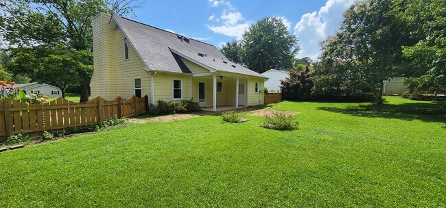 Home from the back - back parch/patio - 209 Seasons Dr