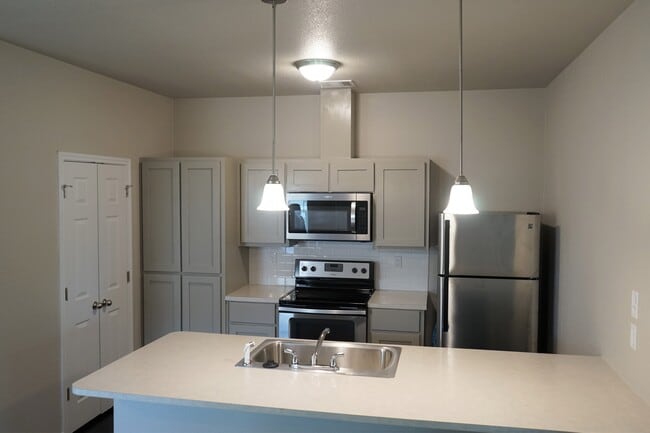 Kitchen with Shaker Style Cabinets comes with Stainless Steel Fridge - 126 E Ball Rd