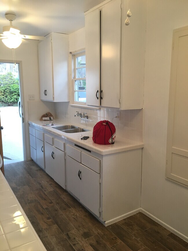 Kitchen leading out to private driveway - 638 Sheldon St