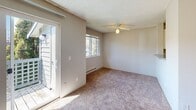 Located at 425 85th Pl SW in Everett, Washington, this single-floor residence offers a straightforward and functional layout designed for comfortable everyday living. The floor plan, as seen in the 3D model, flows between a kitchen area, living space, bedroom, and bathroom in a compact, efficient arrangement.

The living area is carpeted and features a wood-burning fireplace with a tiled hearth, serving as a natural focal point. Track lighting overhead and a baseboard heating system add practicality, while a sliding glass door opens to an outdoor area, allowing natural light to fill the room. A ceiling fan is also present, contributing to year-round comfort.

The kitchen is equipped with white cabinetry, speckled granite-style countertops, wood-look flooring, and a black range, offering a clean and functional cooking space. The layout provides countertop space on both sides, making meal preparation convenient.

The bedroom is carpeted, features a window with an outdoor view of surrounding greenery, and includes baseboard heating. Textured ceilings are consistent throughout the space.

The bathroom includes wood-look flooring, light aqua-toned wall surrounds, a full soaking tub with shower, a window for natural light, and a granite-style vanity countertop, completing the home with a clean, refreshed aesthetic.