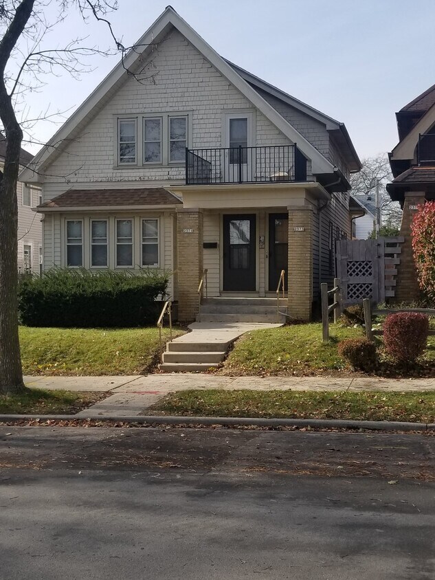 Fresh professionally painted and carpeted throughout this upper unit near Tosa! New ceiling fans. Large Kitchen w/ new refridgerator, dishwasher & Butler's Pantry. Off street parking includes garage & outside spaces one each. Old world wood work & leaded glass built ins. Front & back balconies - 2373 N 56th St