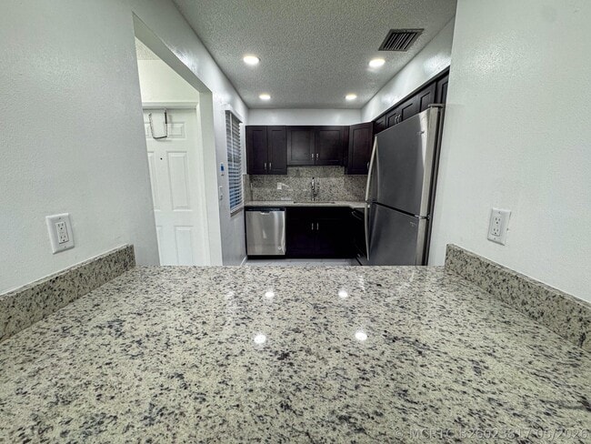 Building Photo - 10687 Royal Palm Blvd