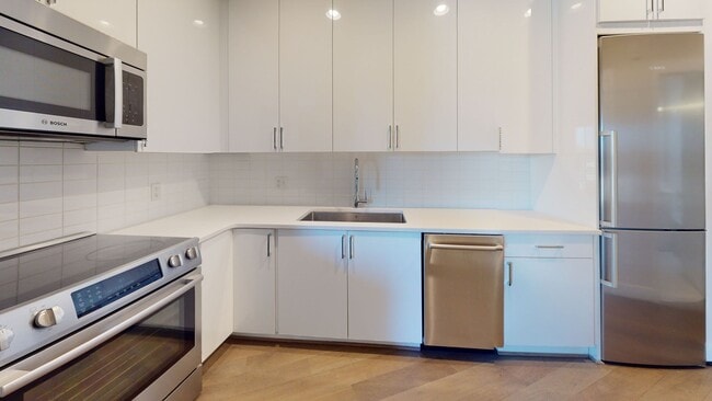 Photo - Updated Junior One Bedroom W/Full Sized Washer/Dryer, Large Bathroom, Spacious Kitchen, & More! Apartment