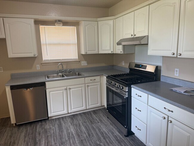 Building Photo - New paint and appliances, luxury vinyl plank and a fenced yard, these 3 beds 1.5 bath is ready fo...