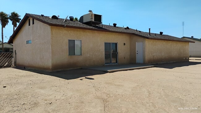 Back of house with patio - 7619 Pismo Ave