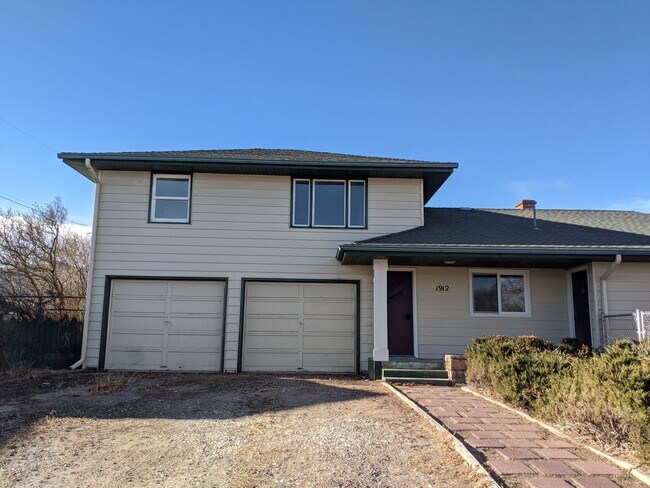 The apartment is above the garage stalls. - 1912 N Cooke St
