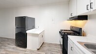 Located at 3101 Sappington Pl in Fort Worth, TX, this single-floor, 2-bedroom unit offers a functional and efficiently designed layout. The space is thoughtfully arranged to maximize every square foot across its two bedrooms and kitchen.

Both bedrooms feature soft, neutral-toned carpet flooring, bright white walls, and ceiling fans with integrated lighting, contributing to a clean and comfortable atmosphere. Natural light filters in through blinded windows, enhancing the airy feel of each room. The primary bedroom is generously proportioned and includes a built-in closet with bi-fold doors, offering practical storage. The second bedroom mirrors the same clean aesthetic with its own ceiling fan and window.

The kitchen is a standout feature, showcasing crisp white cabinetry extending from floor to ceiling, light wood-look vinyl plank flooring, and white countertops. Black appliances — including a gas range and refrigerator — provide a sharp contrast against the bright cabinetry. A stainless steel sink with a matte black faucet adds a modern touch, while the under-cabinet range hood and ample cabinet storage make this kitchen both functional and visually appealing.

The overall design is clean, minimal, and well-maintained, offering a bright and practical living environment in a straightforward, easy-to-navigate single-level layout.