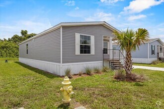 Building Photo - 6680 Hidden Oaks Dr