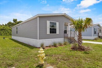 Building Photo - 6680 Hidden Oaks Dr