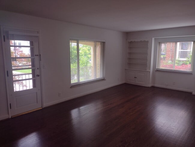 Living Room w/ Door to Balcony - 5702 Doerger Ln