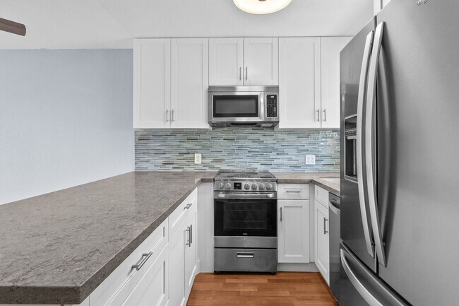 Building Photo - Pristine Two bedroom Two bath condo with b...