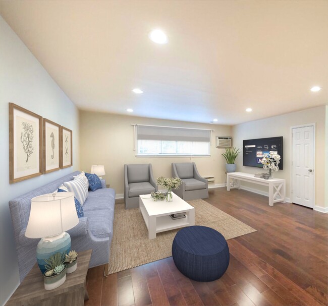 Living room with updated flooring - Rittenhouse Apartments