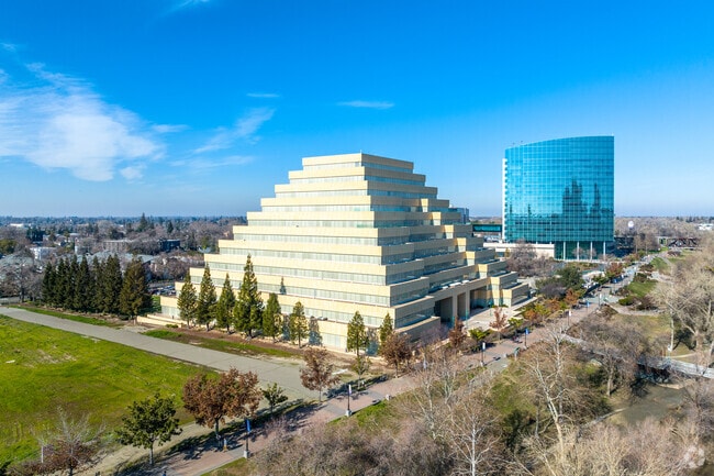 Glassy offices overlook the Ziggurat building.