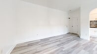 This 350 square foot studio apartment in Los Angeles offers a thoughtfully designed living space that maximizes functionality and style. The open-concept layout seamlessly integrates the living room, kitchen, and sleeping area, creating a sense of spaciousness despite the compact footprint.

The kitchen is a standout feature, boasting white cabinetry with gold hardware, stainless steel appliances, and a striking patterned tile backsplash that adds visual interest. An arched entryway and recessed lighting lend a touch of architectural charm.

The living area features light-toned wood-look flooring that extends throughout the space, enhancing the bright and airy atmosphere. Clean white walls provide a neutral backdrop, perfect for personalizing the space.

The bathroom showcases a modern design with large format white tiles, a decorative mosaic border, and a combined tub-shower unit. A window allows for natural light and ventilation.

Despite its modest size, the apartment doesn't compromise on amenities. The thoughtful layout and design elements create a comfortable and stylish living environment, ideal for those seeking an efficient urban lifestyle in the heart of Los Angeles.