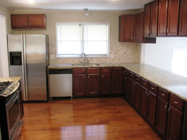 Kitchen opens to den - 518 Barbashela Cir