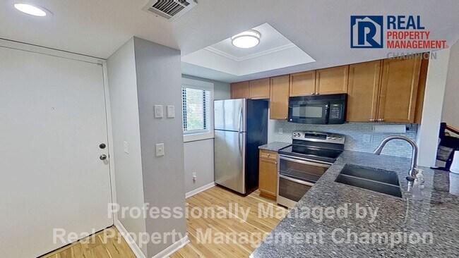 Building Photo - 2 BD/2 BA Second Floor Condo w/ Central Wi...