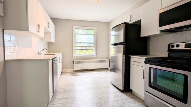 Photo du bâtiment - Bright And Cozy One-Bedroom In Downtown Ki...