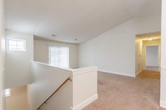 Upper apartments have beautiful cathedral ceilings in the living area providing a lot of nature light! - Jordache Park Apartments