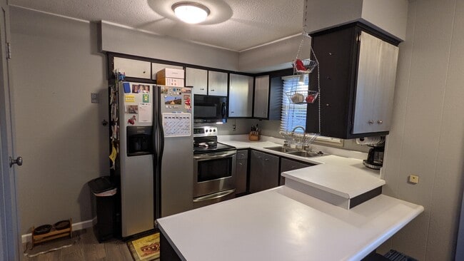 Kitchen with stainless steel appliances - 2431 Saratoga Rd